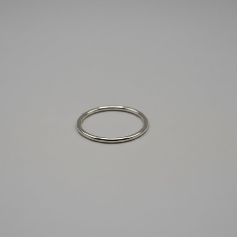 Silver ring on a grey background