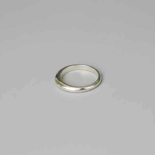 Silver ring on a grey background