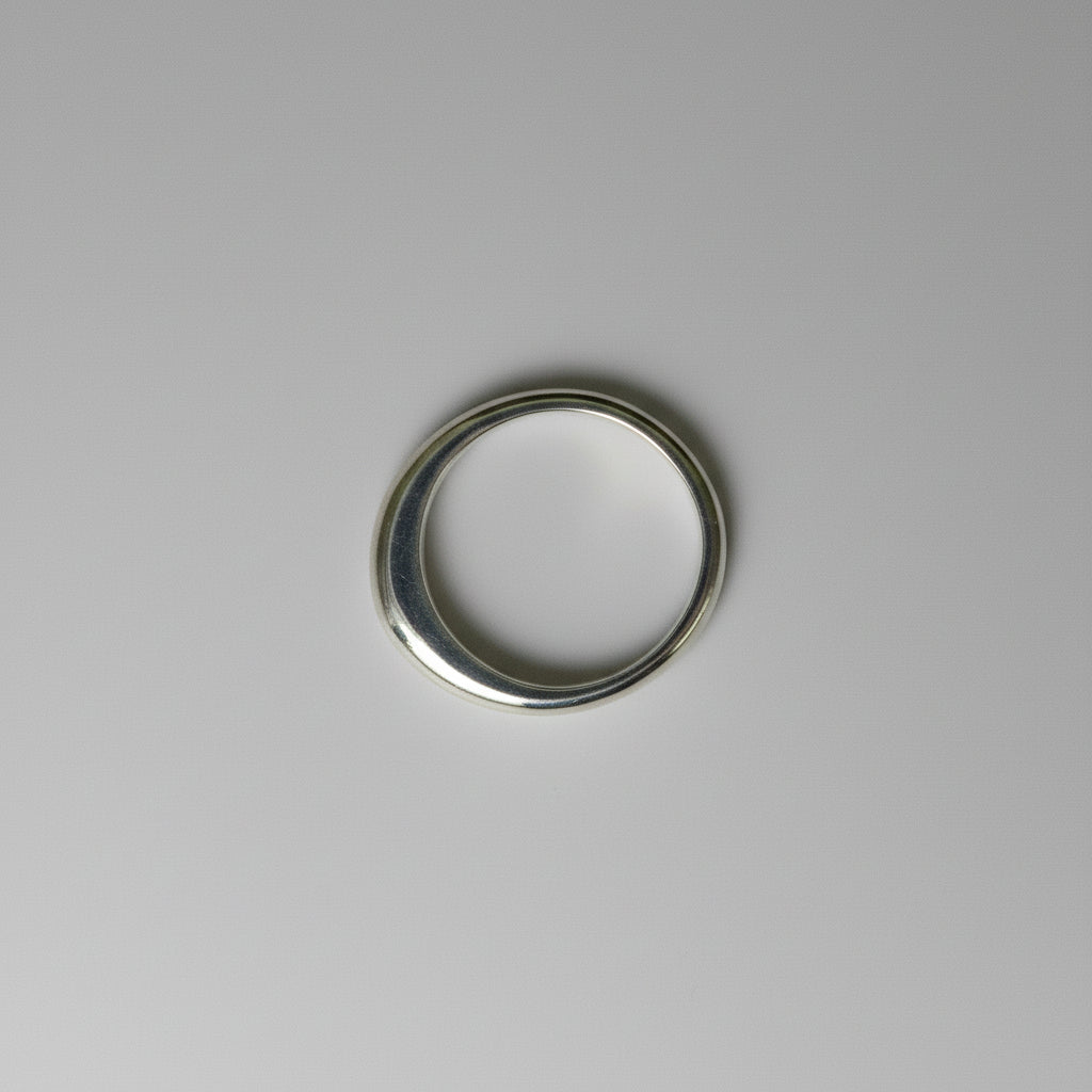 Silver ring on a grey background