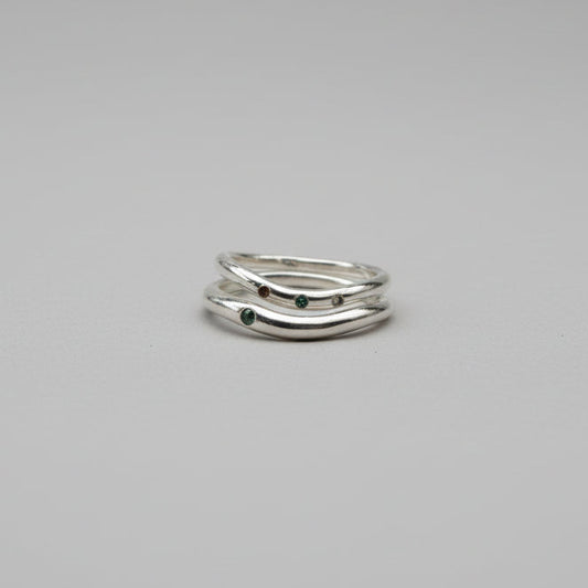 Silver rings on a studio grey background