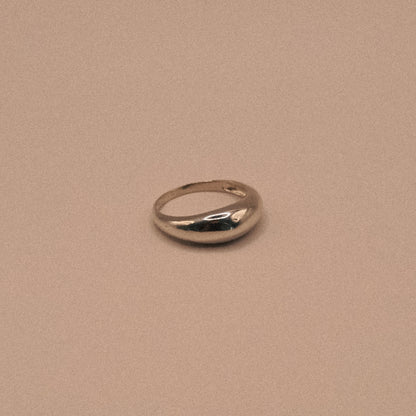 Silver ring on a beige background