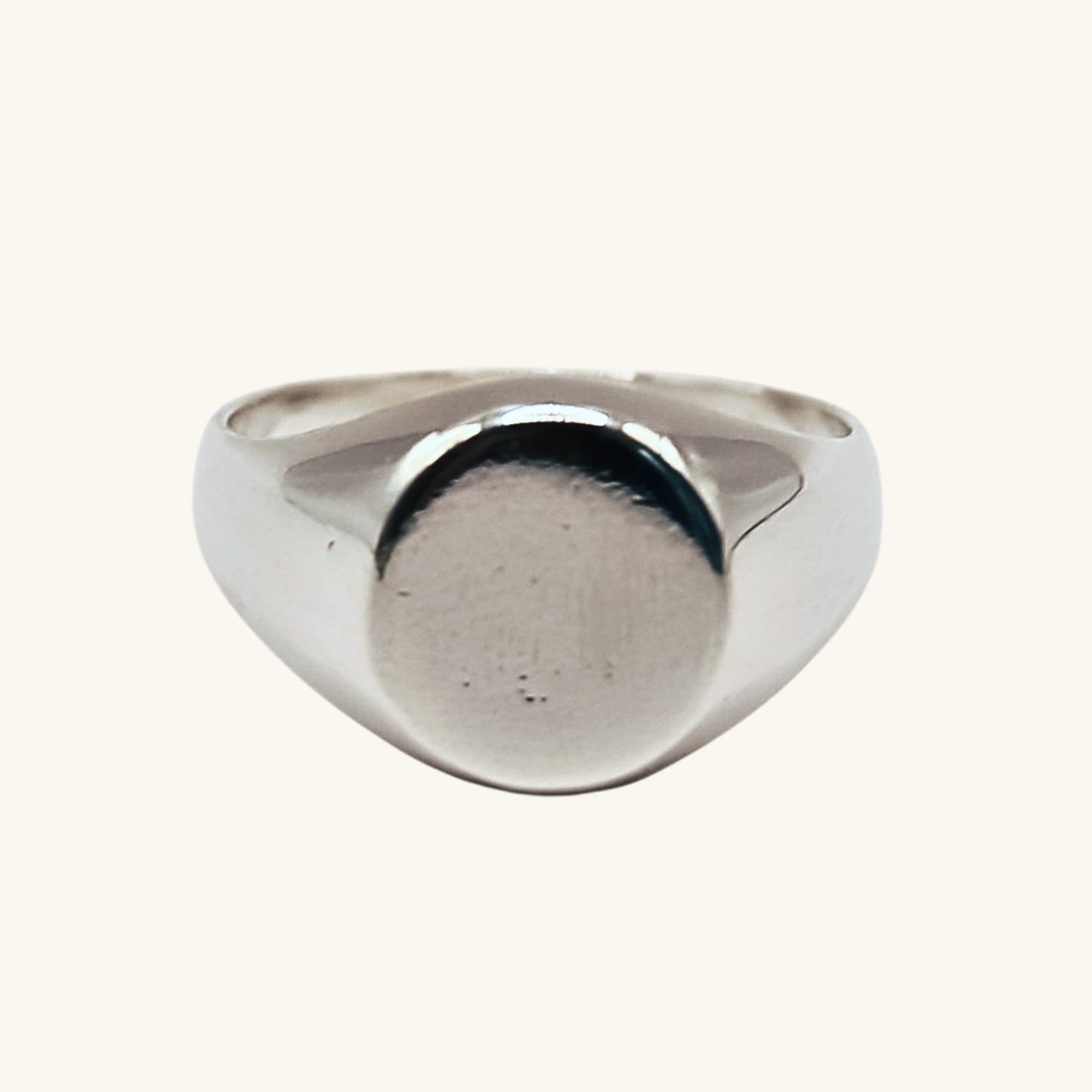 Silver ring on a white background