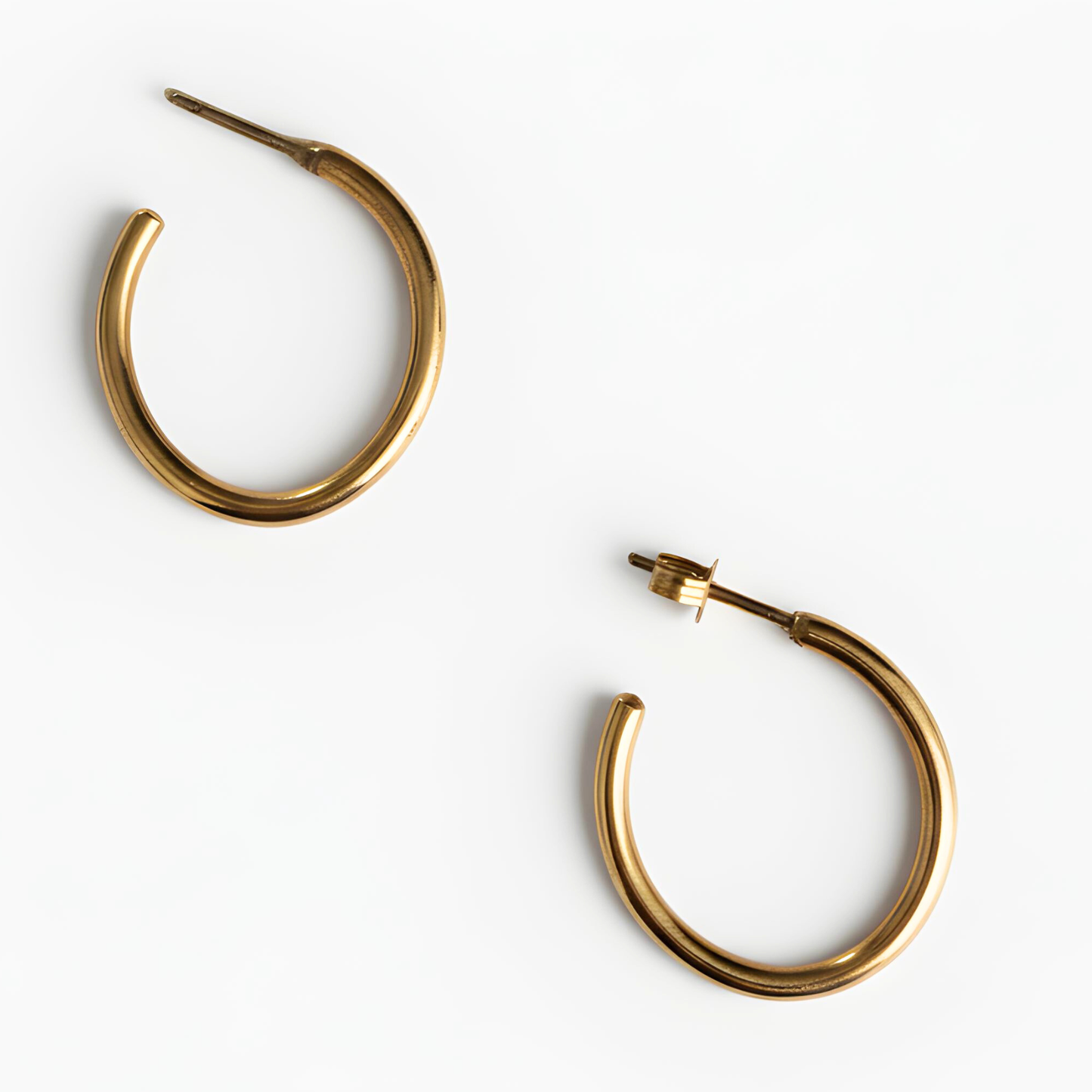 Gold hoop earrings on a white background