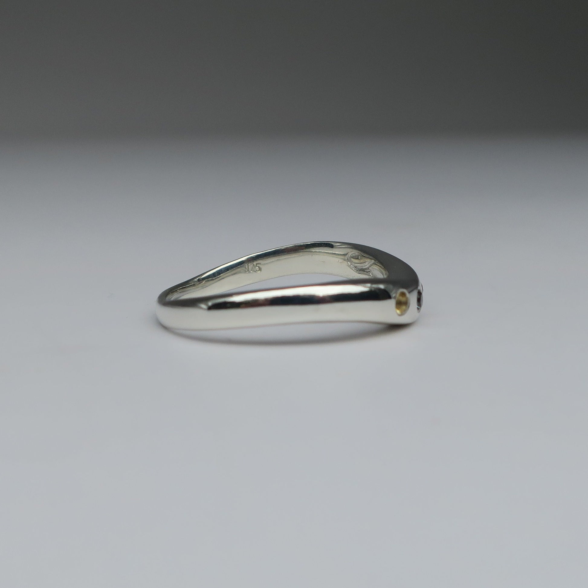 Silver ring on a white background