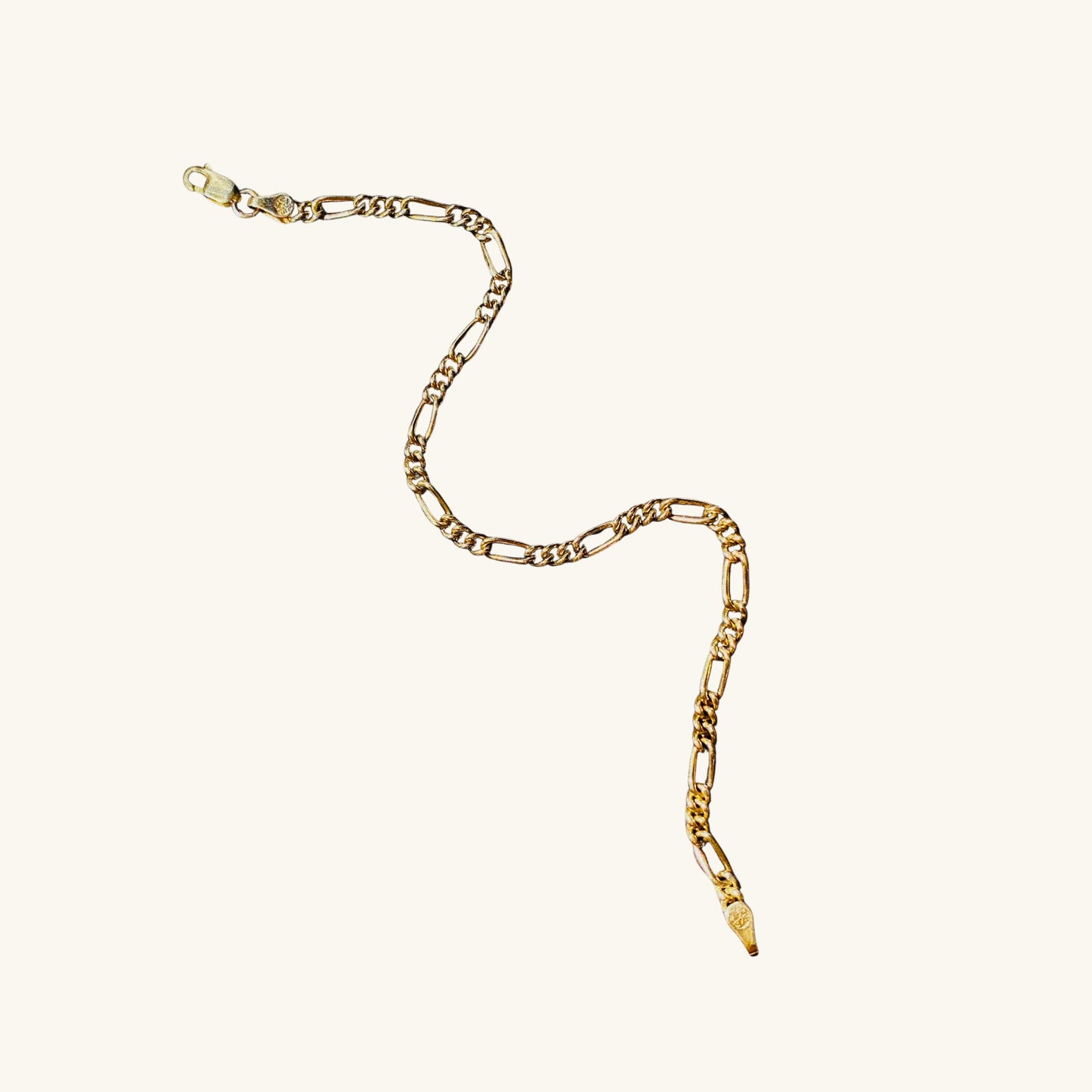 Gold chain necklace on a white background