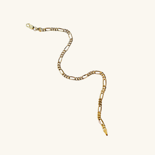 Gold chain necklace on a white background