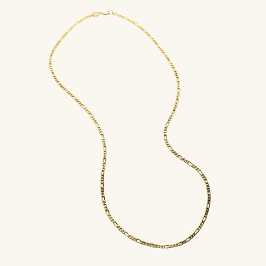 Gold chain necklace on a white background