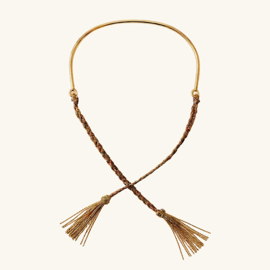 Necklace with braided design and tassels on a white background