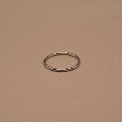 Silver ring on a beige background