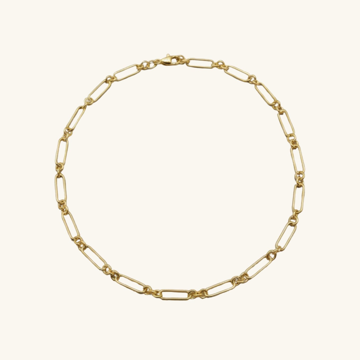 Gold chain necklace on a white background