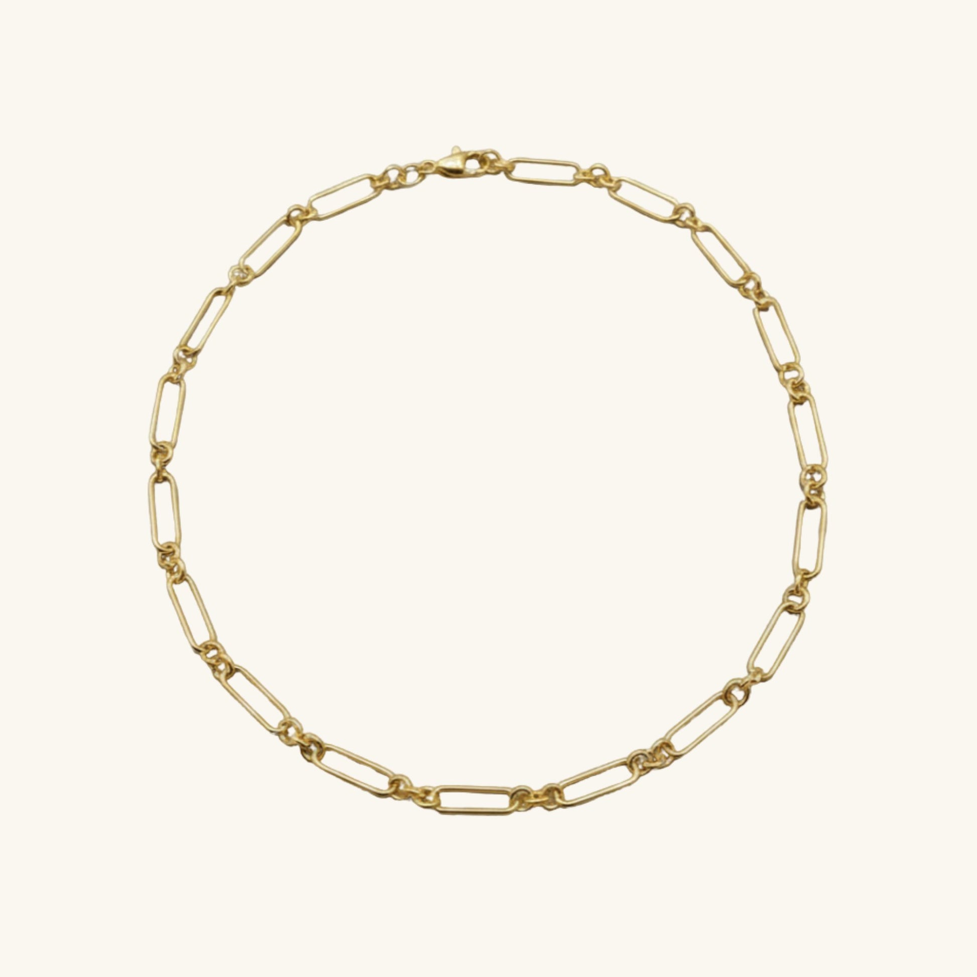 Gold chain necklace on a white background