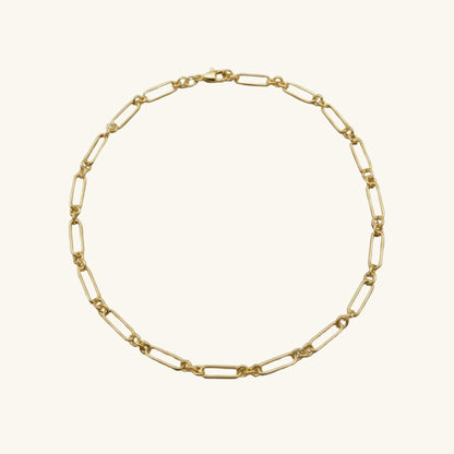 Gold chain necklace on a white background