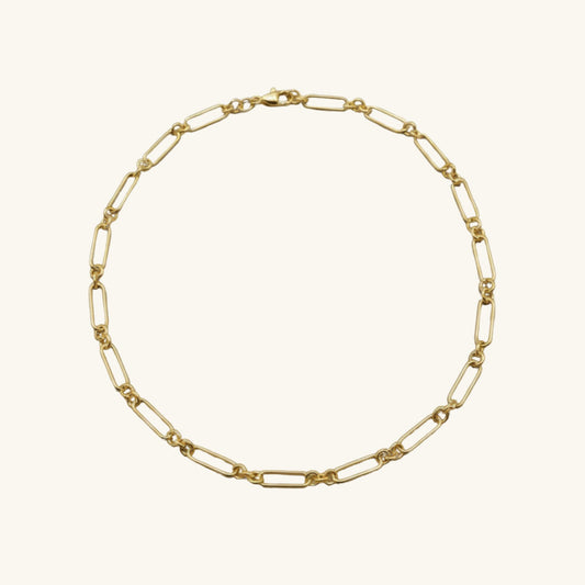 Gold chain necklace on a white background