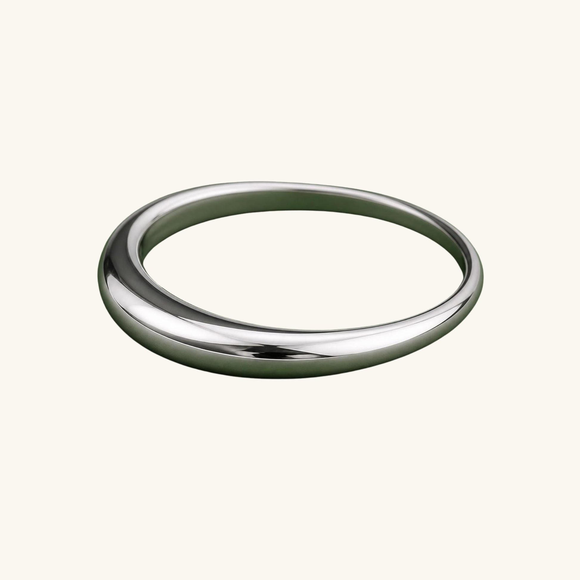 Silver ring on a cream background