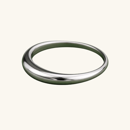 Silver ring on a cream background