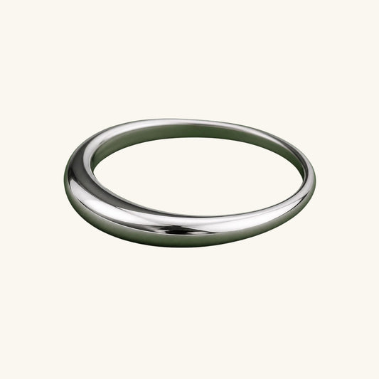 Silver ring on a cream background