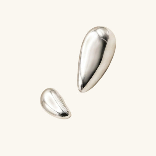 Two silver teardrop-shaped earrings on a white background