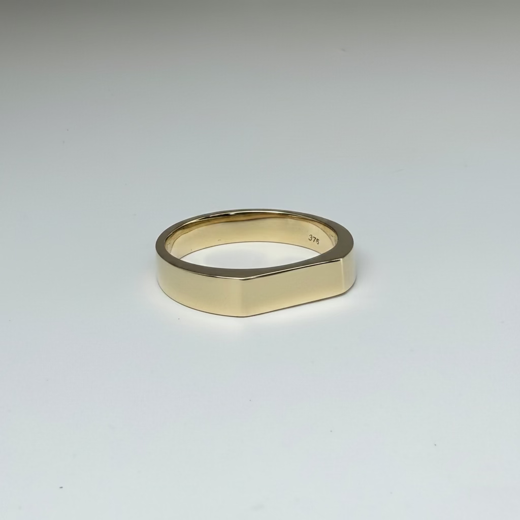 Gold ring on a light gray background