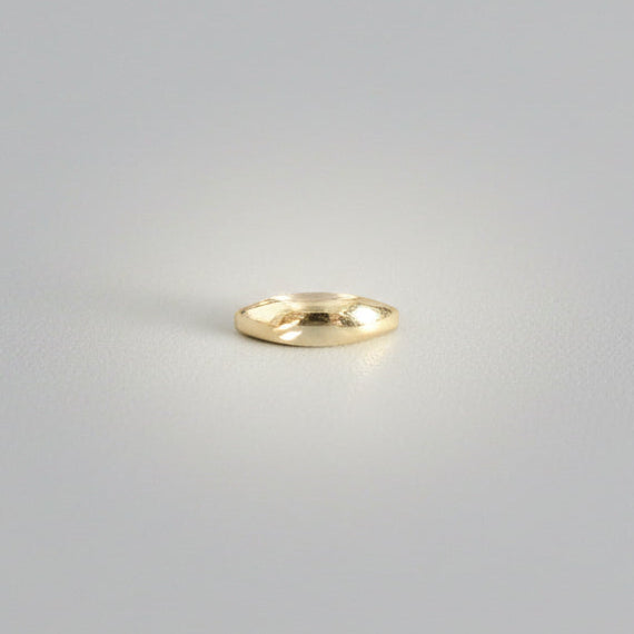 Sculptural ring on a studio background