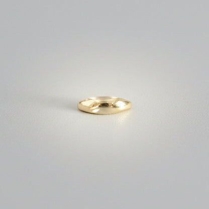Sculptural ring on a studio background