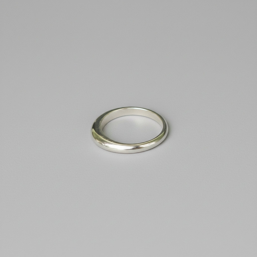 Silver ring on a grey background