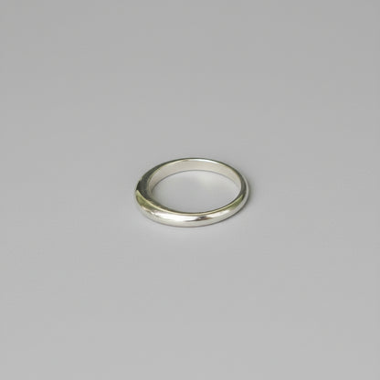 Silver ring on a grey background