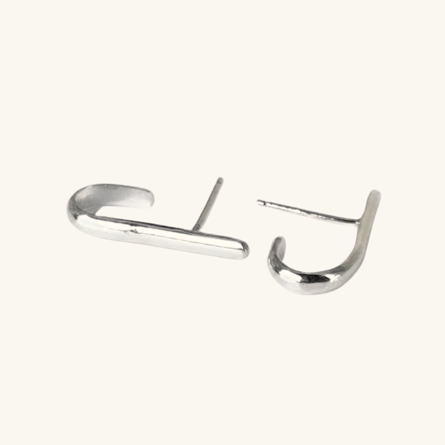 Pair of silver hoop earrings on a white background