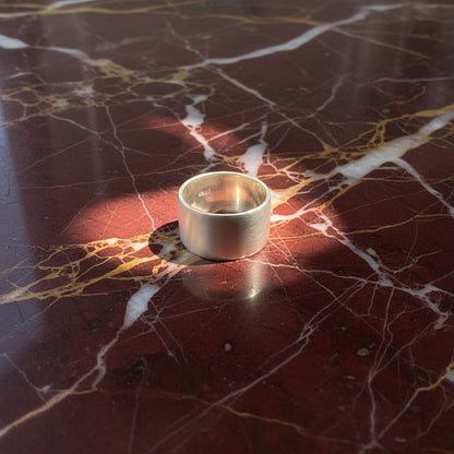 Round metallic ring on a marble background