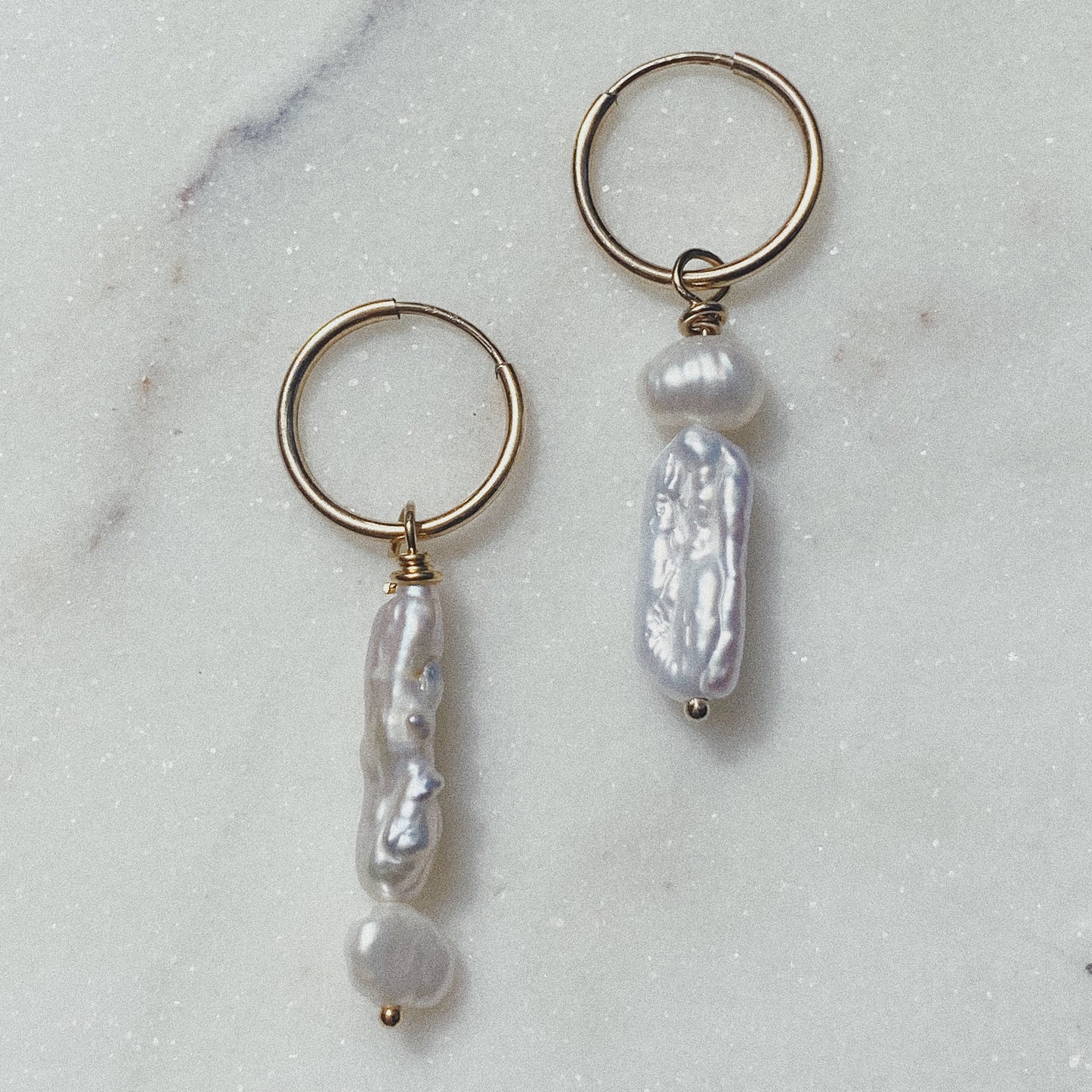 close up of the anais hoops on a marble backdrop