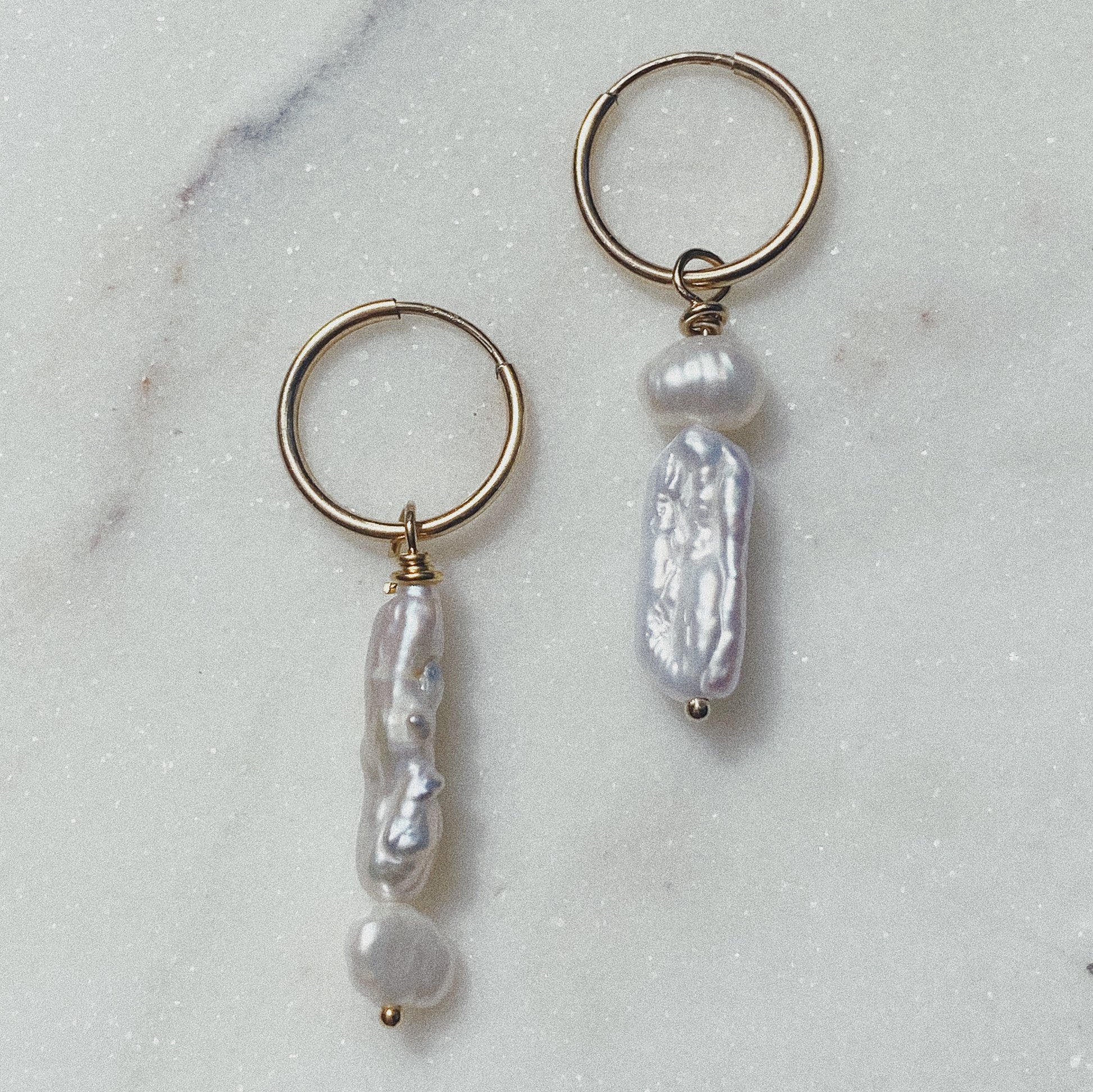 close up of the anais hoops on a marble backdrop